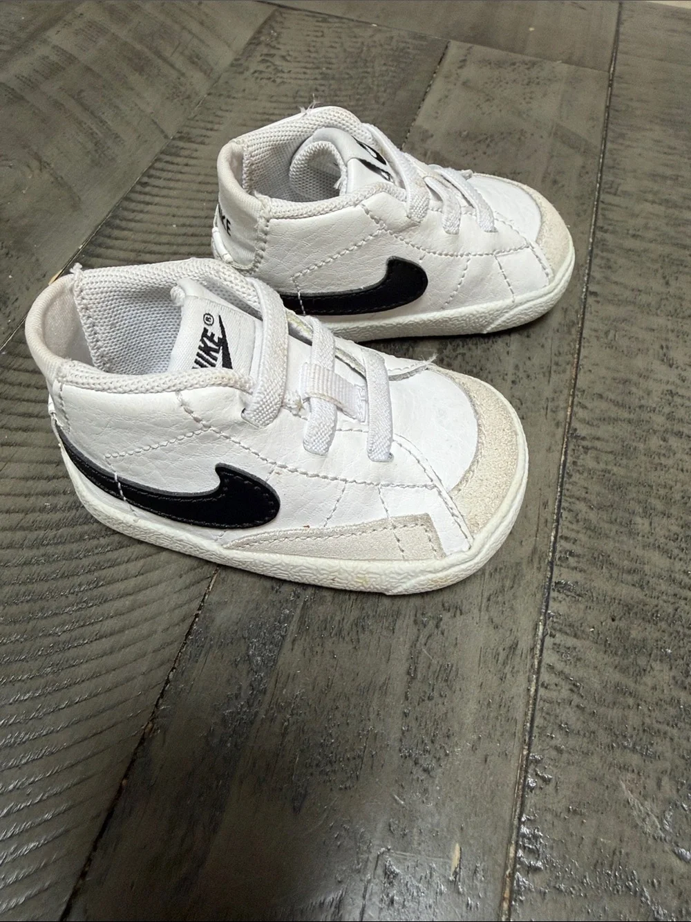 Nike Kids White Sneakers with Black Swoosh
